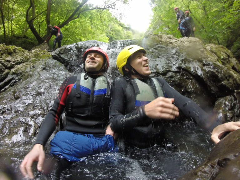 Sitting underneath a waterfall in the Brecon Beacons